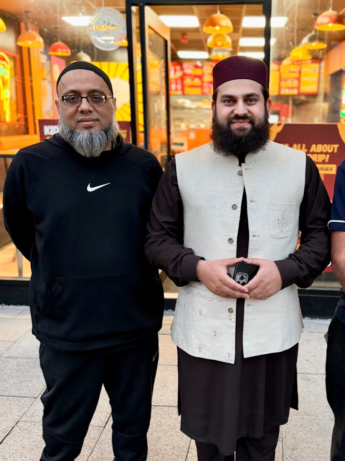 Hafiz Ahmed Raza Qadri with Muhammad Khushtar outside Arizona Crispy in Bury